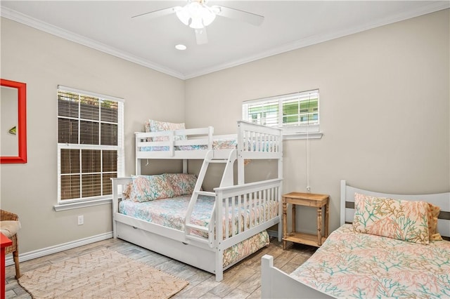 623 Sandkey Dr, Port Aransas, TX 78373 - bedroom featuring wood finished floors, crown molding, baseboards, a ceiling fan, and recessed lighting