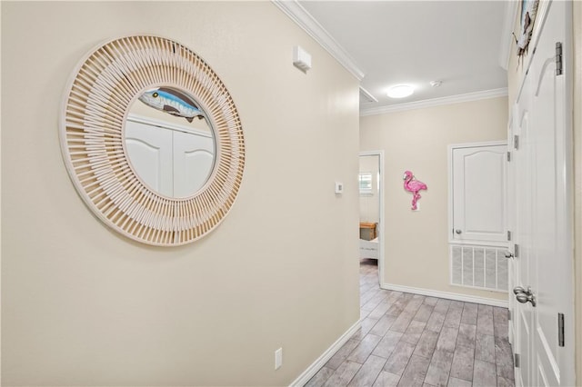 623 Sandkey Dr, Port Aransas, TX 78373 - corridor with baseboards, light wood-type flooring, and crown molding
