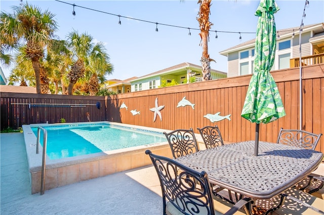 view of swimming pool featuring a patio area