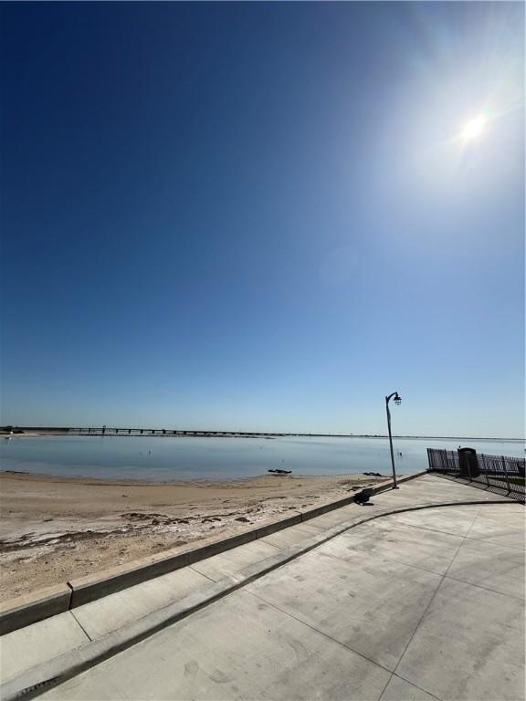 249 Lola Johnson, Corpus Christi, TX 78418 - property view of water featuring a view of the beach
