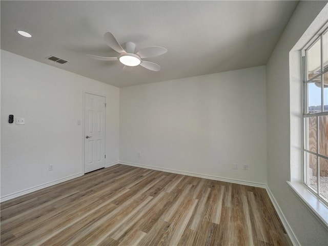 13818 Halyard Dr, Corpus Christi, TX 78418 - spare room with a ceiling fan, wood finished floors, visible vents, and baseboards