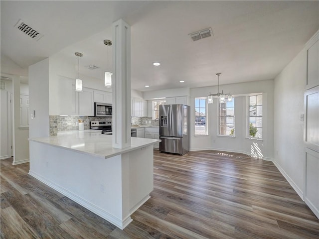 13818 Halyard Dr, Corpus Christi, TX 78418 - kitchen with dark wood-style floors, appliances with stainless steel finishes, and visible vents
