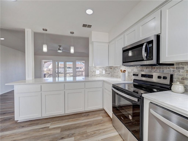 13818 Halyard Dr, Corpus Christi, TX 78418 - kitchen with white cabinets, tasteful backsplash, visible vents, and stainless steel appliances