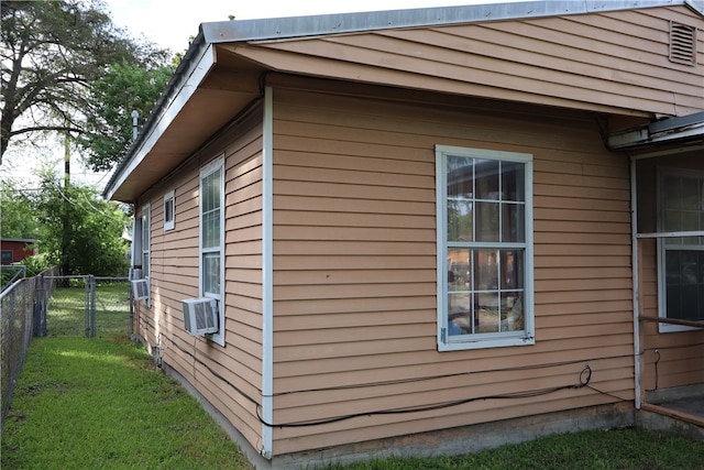 view of property exterior featuring a yard and cooling unit