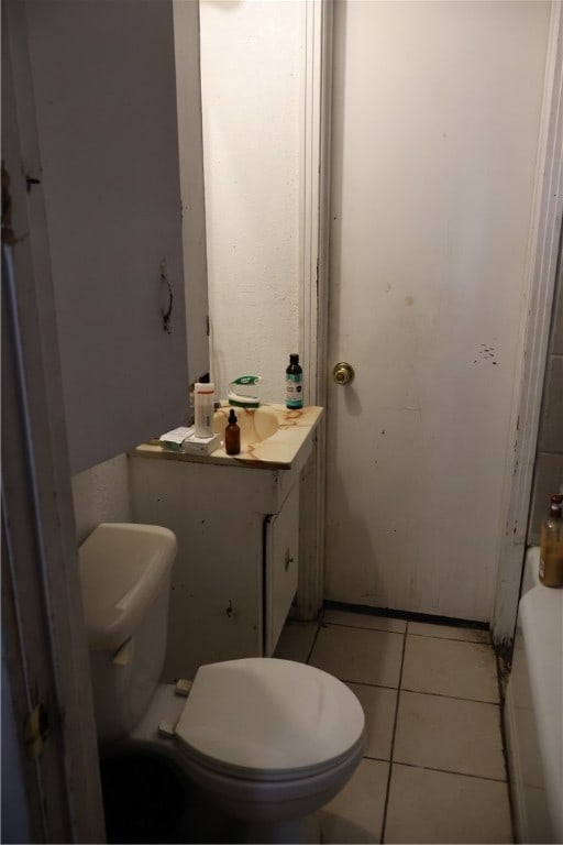 bathroom featuring toilet and tile patterned floors