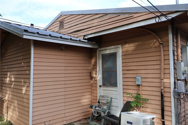 view of side of property featuring cooling unit