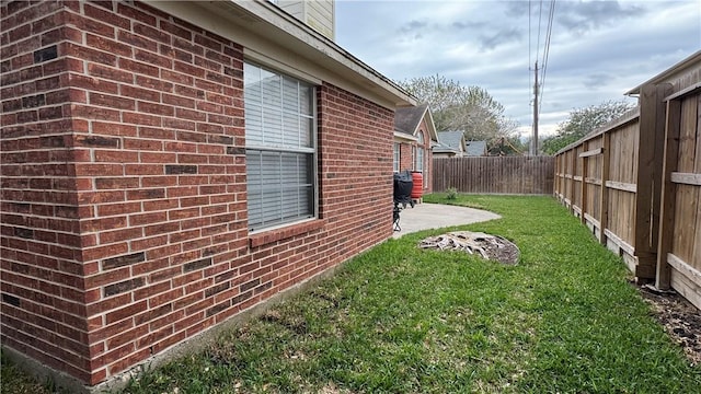 5906 Lindenwood Dr, Corpus Christi, TX 78414 - view of side of home featuring a lawn and a patio