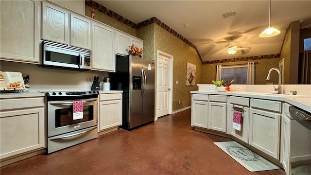 5906 Lindenwood Dr, Corpus Christi, TX 78414 - kitchen with ceiling fan, sink, stainless steel appliances, and decorative light fixtures