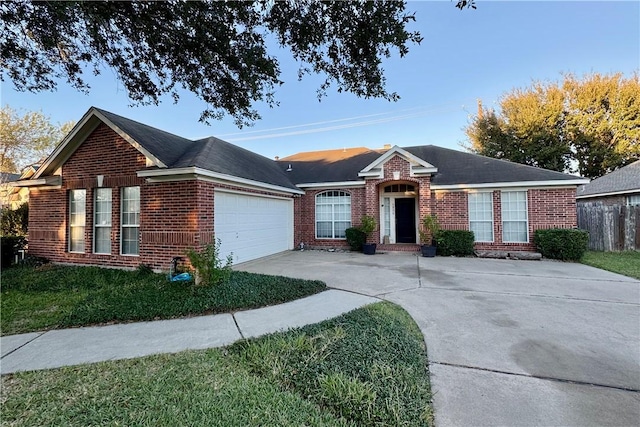 ranch-style house featuring a garage