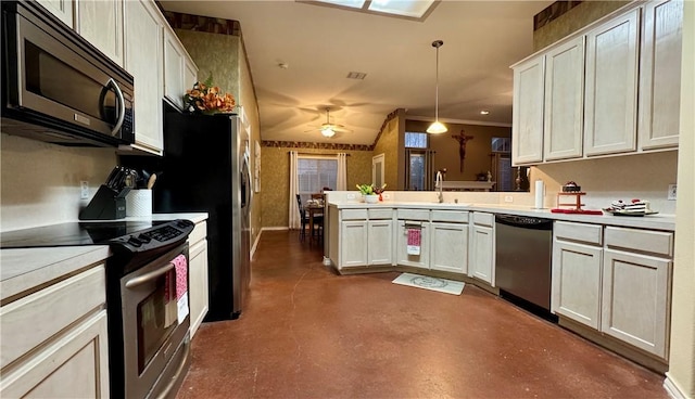 5906 Lindenwood Dr, Corpus Christi, TX 78414 - kitchen featuring white cabinets, hanging light fixtures, ceiling fan, kitchen peninsula, and stainless steel appliances