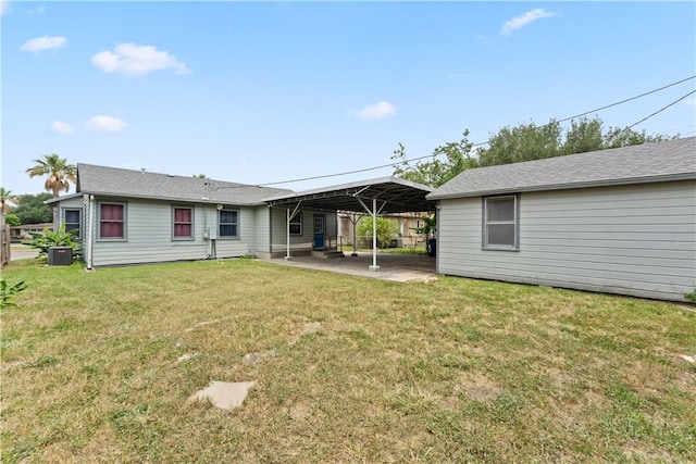 4002 Brawner Pkwy, Corpus Christi, TX 78411 - back of house with a carport, a patio, a lawn, and central AC unit