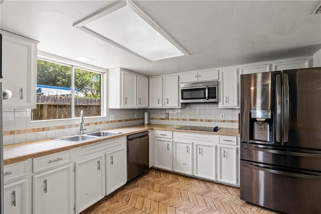 5110 Cascade Dr, Corpus Christi, TX 78413 - kitchen with stainless steel appliances, white cabinetry, and light countertops