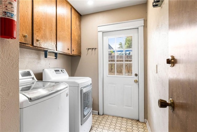 5110 Cascade Dr, Corpus Christi, TX 78413 - laundry area with cabinet space, washer and clothes dryer, and light floors