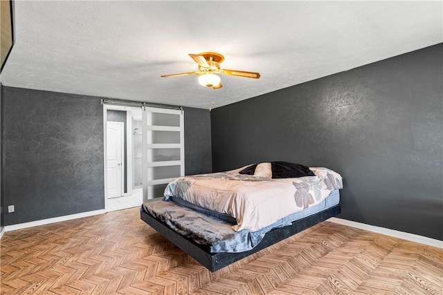 5110 Cascade Dr, Corpus Christi, TX 78413 - bedroom featuring a barn door and ceiling fan