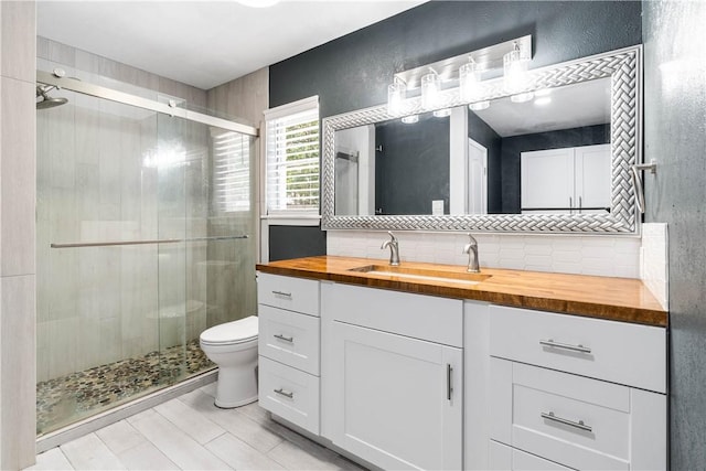 5110 Cascade Dr, Corpus Christi, TX 78413 - full bath featuring a shower stall, vanity, and backsplash