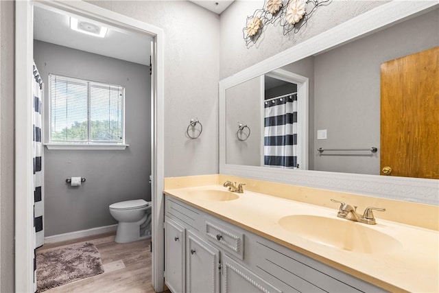 5110 Cascade Dr, Corpus Christi, TX 78413 - full bath featuring double vanity and wood finished floors