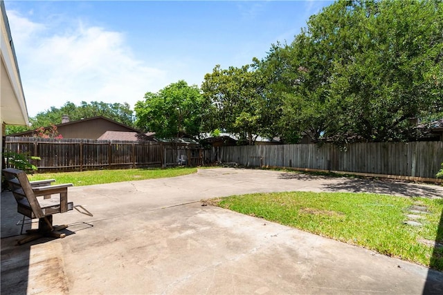 5110 Cascade Dr, Corpus Christi, TX 78413 - fenced backyard with a patio