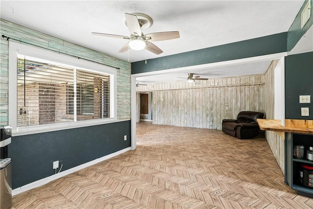 5110 Cascade Dr, Corpus Christi, TX 78413 - sitting room featuring ceiling fan and wooden walls
