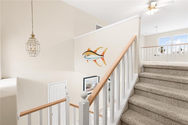 staircase with ceiling fan