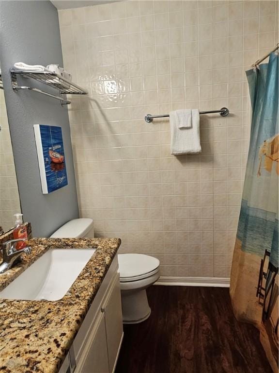 15425 Fortuna Bay Dr Unit 314, Corpus Christi, TX 78418 - full bathroom with vanity, wood finished floors, toilet, baseboards, and curtained shower
