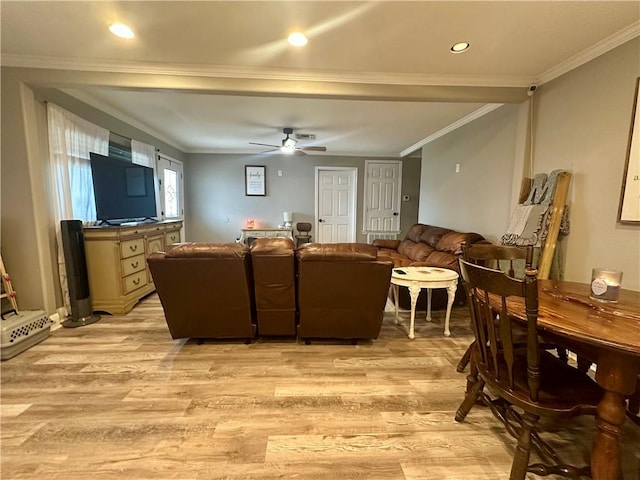 living room featuring crown molding, ceiling fan, and light hardwood / wood-style floors