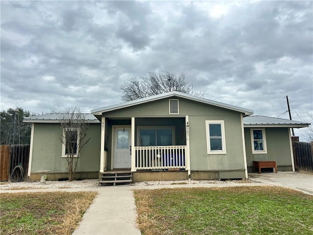 view of front of home featuring a porch and a front yard