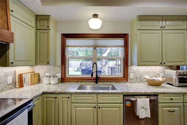 kitchen with sink, decorative backsplash, green cabinetry, and dishwasher