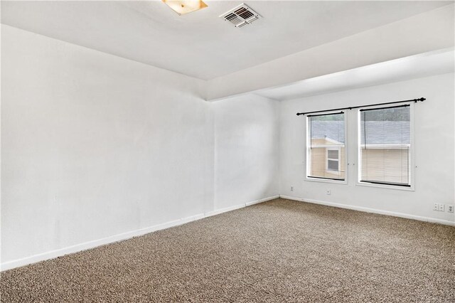 empty room with carpet flooring