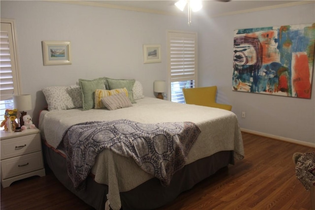 6605 Whitewing Dr, Corpus Christi, TX 78413 - bedroom with dark wood-style floors, crown molding, baseboards, and a ceiling fan