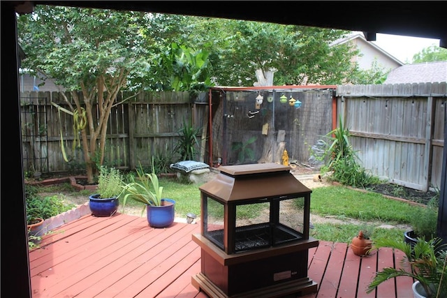 6605 Whitewing Dr, Corpus Christi, TX 78413 - wooden deck featuring a fire pit and a fenced backyard