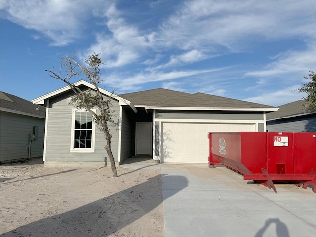 ranch-style home featuring a garage