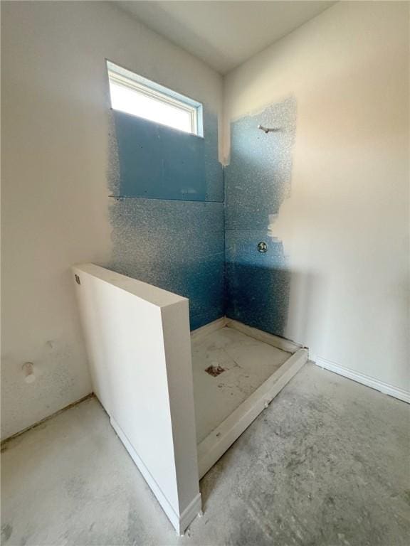 bathroom featuring concrete floors