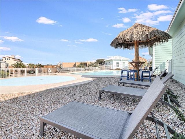 exterior space with fence, a fenced in pool, and a patio