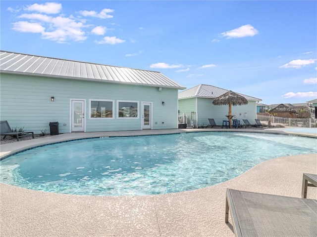 view of pool with a patio area, fence, and a fenced in pool