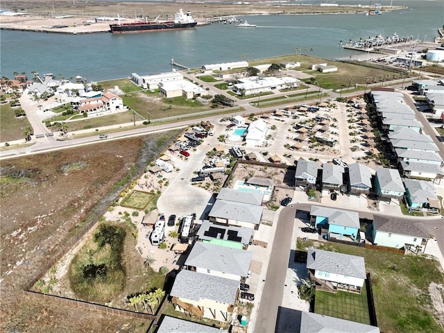 bird's eye view featuring a water view and a residential view