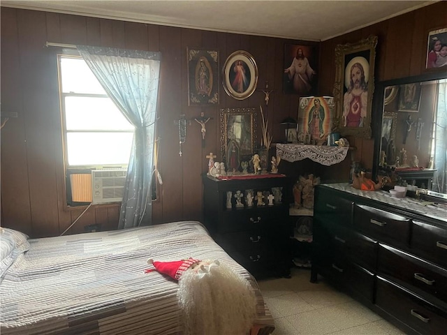 bedroom featuring wood walls and cooling unit