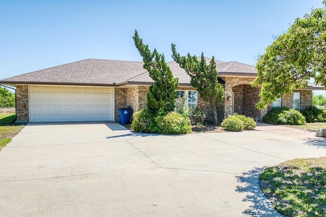 view of front facade with driveway and an attached garage