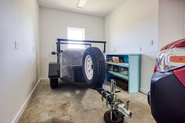 workout room with baseboards