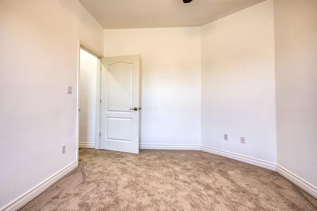 empty room with carpet flooring and baseboards