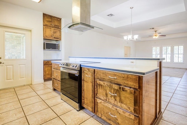 kitchen featuring visible vents, light tile patterned floors, exhaust hood, brown cabinets, and stainless steel range with electric cooktop