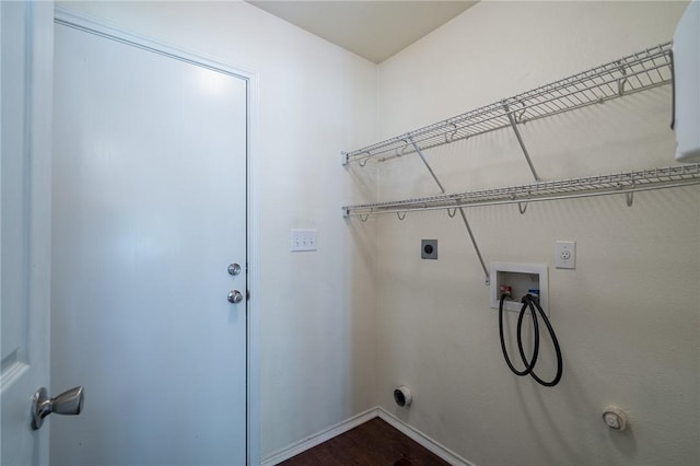 clothes washing area featuring gas dryer hookup, washer hookup, hookup for an electric dryer, and wood-type flooring