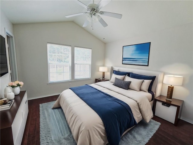 bedroom with ceiling fan, lofted ceiling, and dark hardwood / wood-style floors