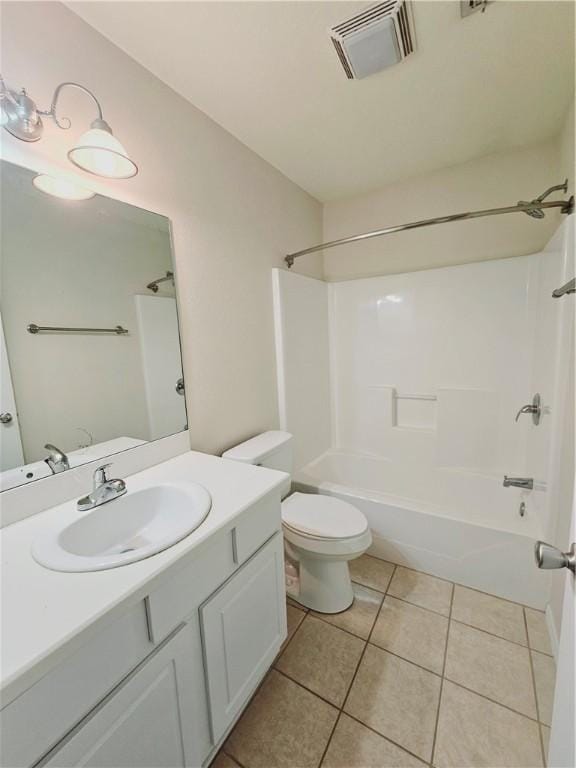 full bathroom with tile patterned flooring, vanity, shower / tub combination, and toilet