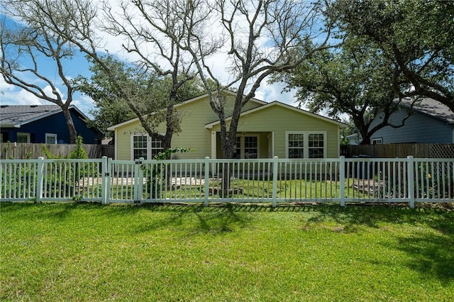 back of house with a yard