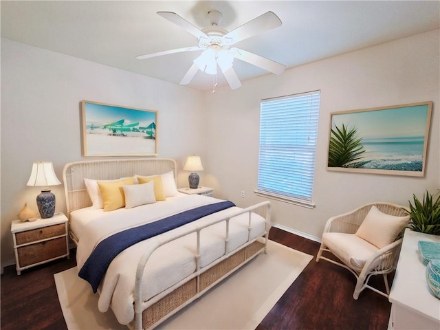 bedroom featuring dark wood-type flooring and ceiling fan