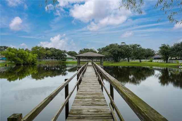 view of dock with a water view and a gazebo