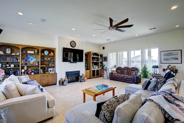 living room with ornamental molding, a fireplace, and ceiling fan