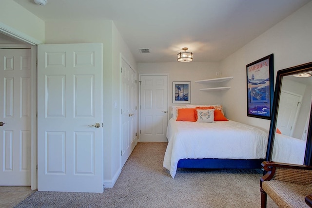 bedroom with light colored carpet