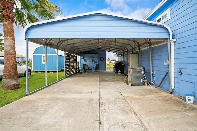 view of parking / parking lot with concrete driveway and a detached carport