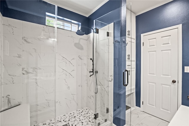 full bathroom featuring a shower stall, ornamental molding, and marble finish floor